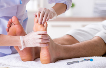 Podiatrist with patient who has neuropathy